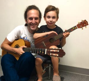 Young Guitar Student in their lesson with teacher